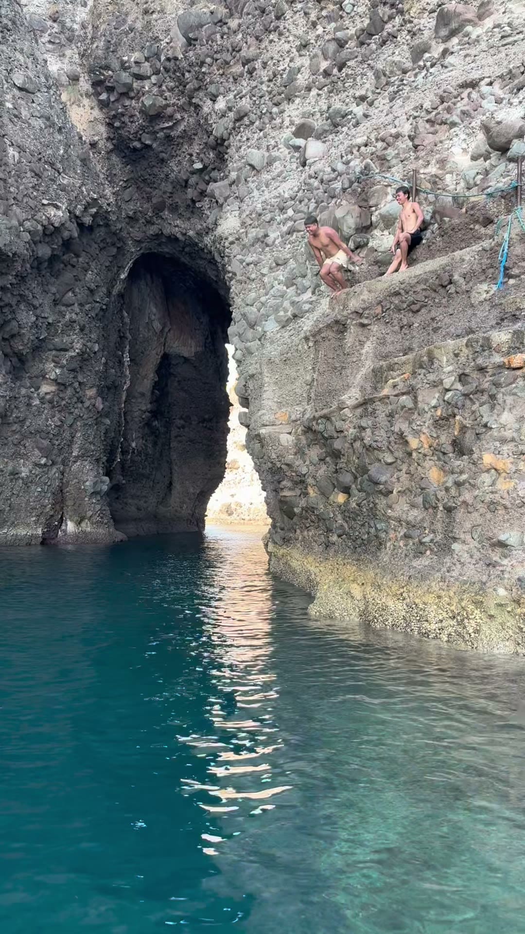A sea cave in clear turquoise water at Kayraan, Batangas